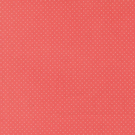 The image is a red background with small white dots, creating a polka dot pattern.