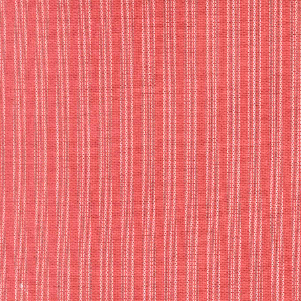 The image is a close-up of a red fabric with white vertical stripes.