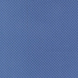 The image is a blue background with white polka dots, creating a playful and whimsical pattern.