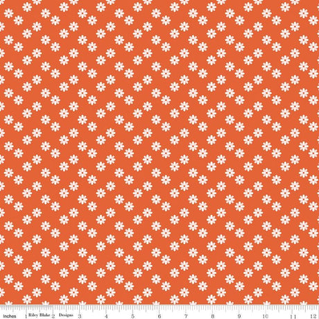 a repeating pattern of small white flowers against a bright orange background.