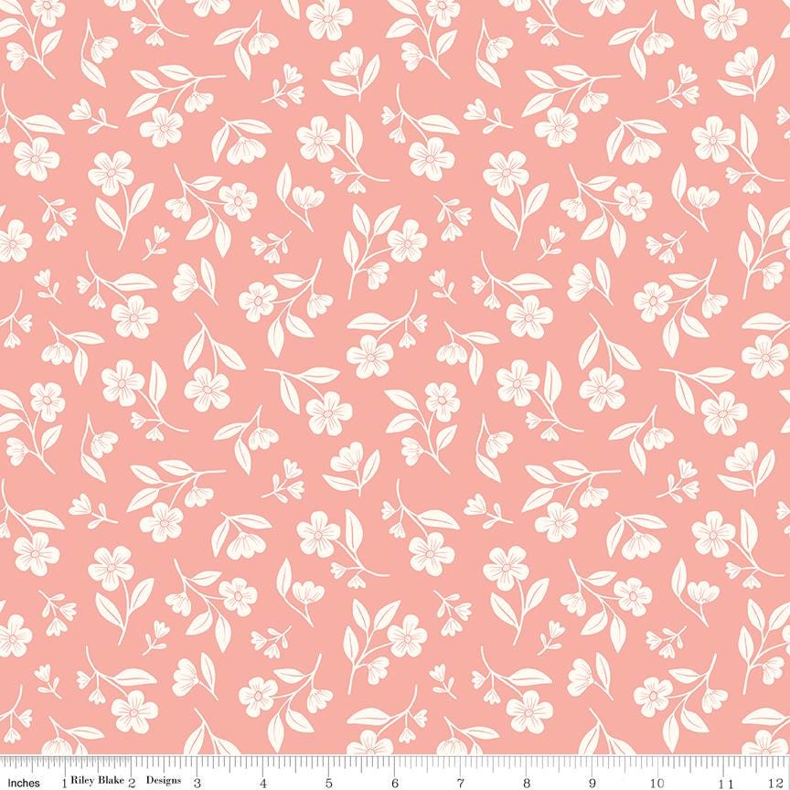 a repeating pattern of white flowers and leaves on a pink background.