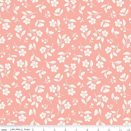 a repeating pattern of white flowers and leaves on a pink background.