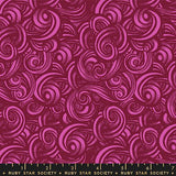 The image is a vibrant, abstract pattern with swirling shapes and lines in shades of pink and red. The pattern appears to be a repeating design, creating a sense of movement and dynamism.