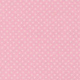 The image is a pink fabric with white polka dots, creating a playful and cheerful pattern.