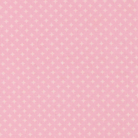 The image is a pink fabric with white polka dots, creating a playful and cheerful pattern.