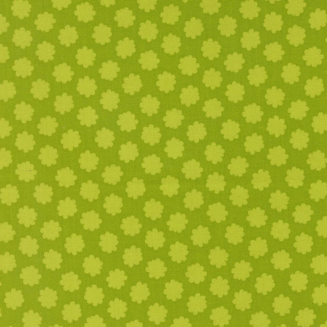 a repeating pattern of green flowers on a green background.