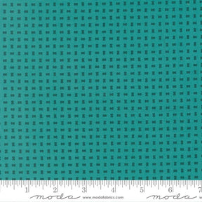 The image is a close-up of a fabric with a grid-like pattern of small black dots or squares, creating a textured appearance.