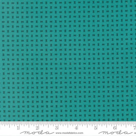 The image is a close-up of a fabric with a grid-like pattern of small black dots or squares, creating a textured appearance.