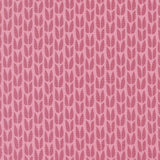 a repeating pattern of pink leaves on a pink background.