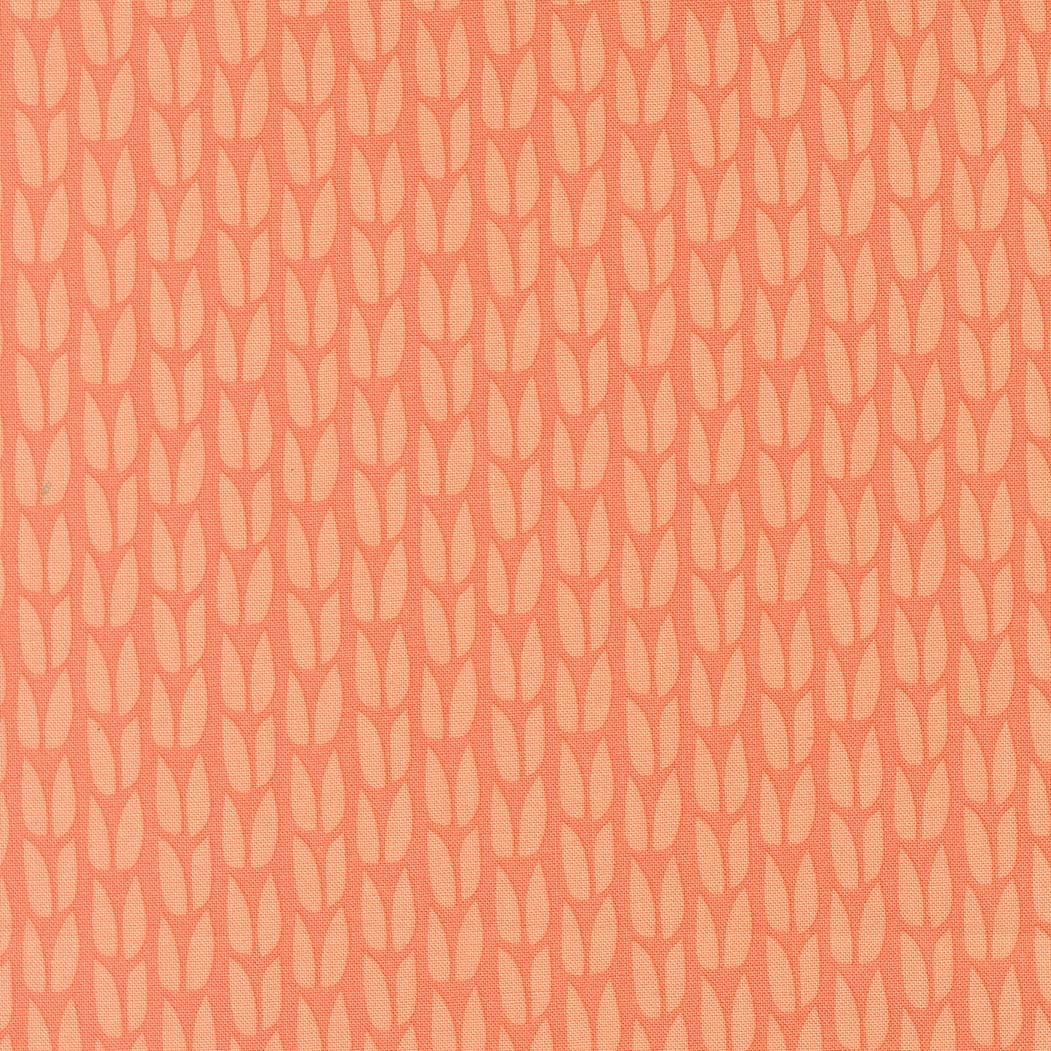 a repeating pattern of orange and white leaf-like shapes arranged in a grid-like fashion.