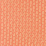 a repeating pattern of orange and white leaf-like shapes arranged in a grid-like fashion.
