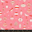 a variety of Christmas ornaments and a bird, arranged in a pattern against a pink background.