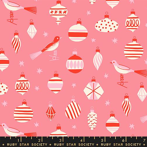 a variety of Christmas ornaments and a bird, arranged in a pattern against a pink background.