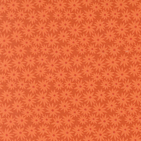 a repeating pattern of orange flowers on a dark background.