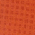 The image is a close-up of a textured orange surface with small square patterns.