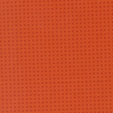 The image is a close-up of a textured orange surface with small square patterns.