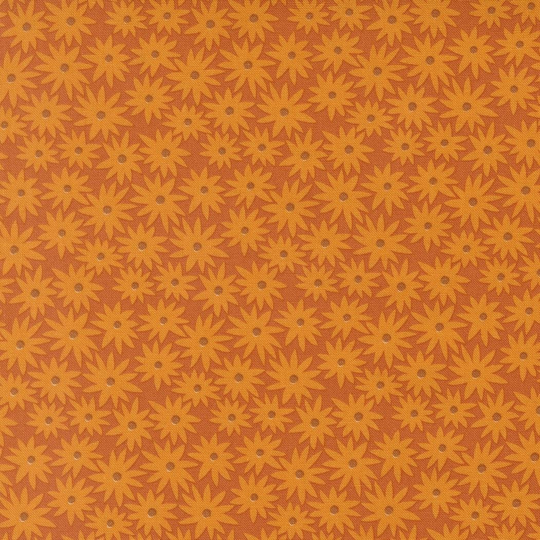 a repeating pattern of yellow flowers against a brown background.
