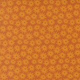 a repeating pattern of yellow flowers against a brown background.