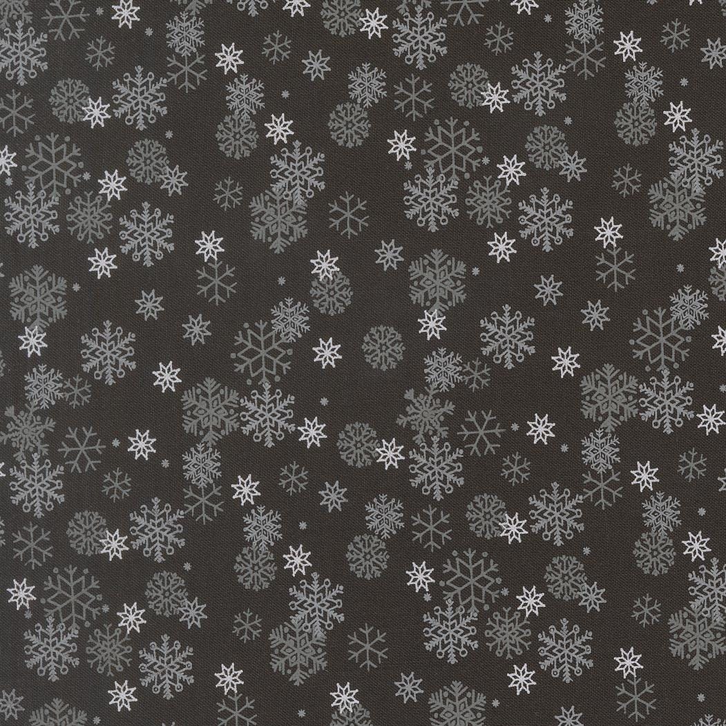 a repeating pattern of white snowflakes against a dark background.