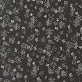 a repeating pattern of white snowflakes against a dark background.