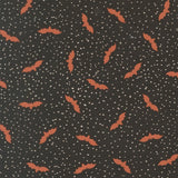 a pattern of orange bats against a dark background with white dots, creating a spooky and festive Halloween-like appearance.