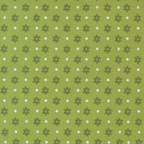 a repeating pattern of green flowers with white polka dots on a green background.