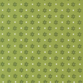 a repeating pattern of green flowers with white polka dots on a green background.