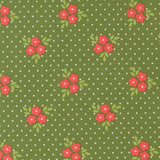 a pattern of green fabric with white polka dots, each adorned with red flowers and green leaves.