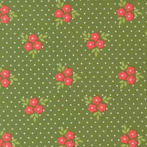 a pattern of green fabric with white polka dots, each adorned with red flowers and green leaves.