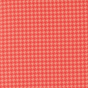 a repeating pattern of red and pink hues, creating a visually striking and symmetrical design.