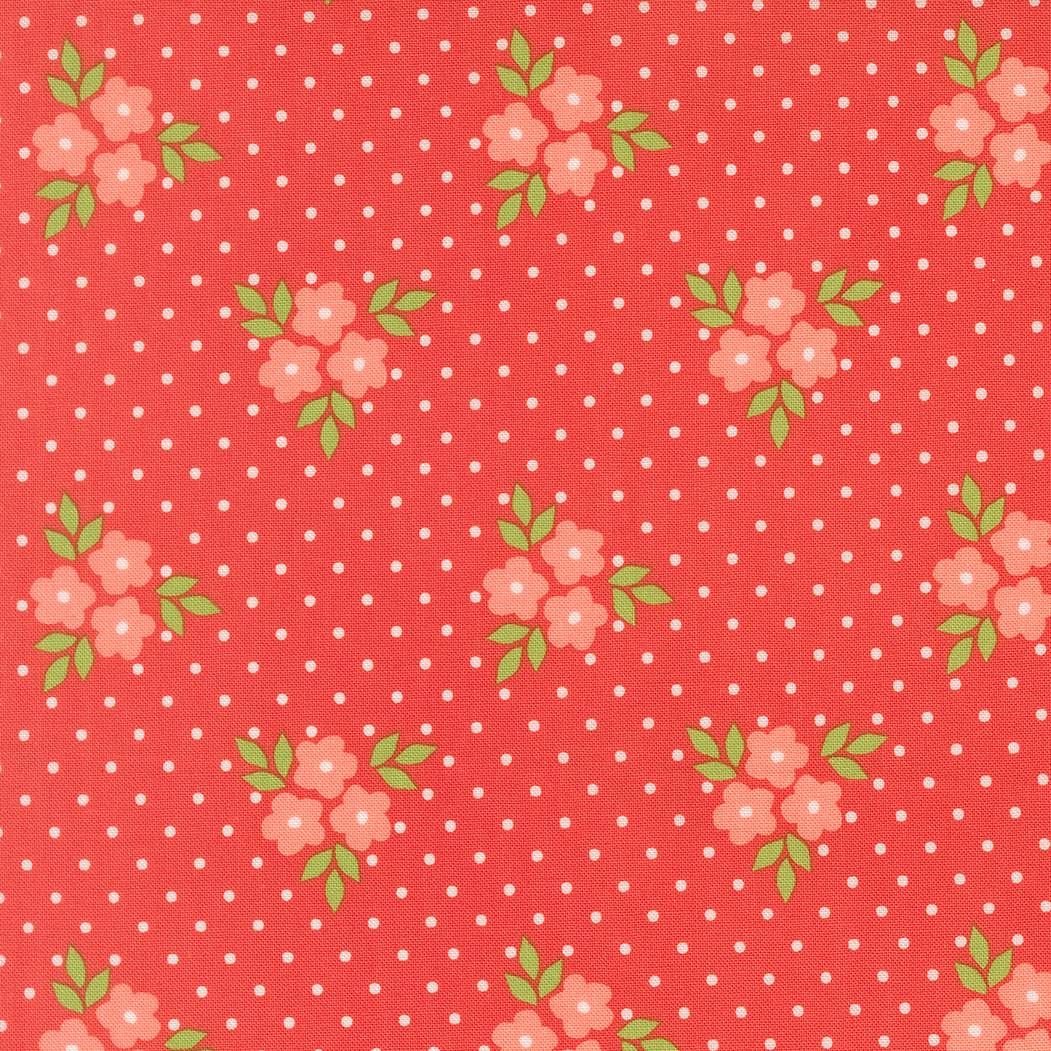 a repeating pattern of pink flowers with green leaves against a red background with white polka dots.