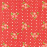 a repeating pattern of pink flowers with green leaves against a red background with white polka dots.