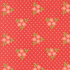 a repeating pattern of pink flowers with green leaves against a red background with white polka dots.