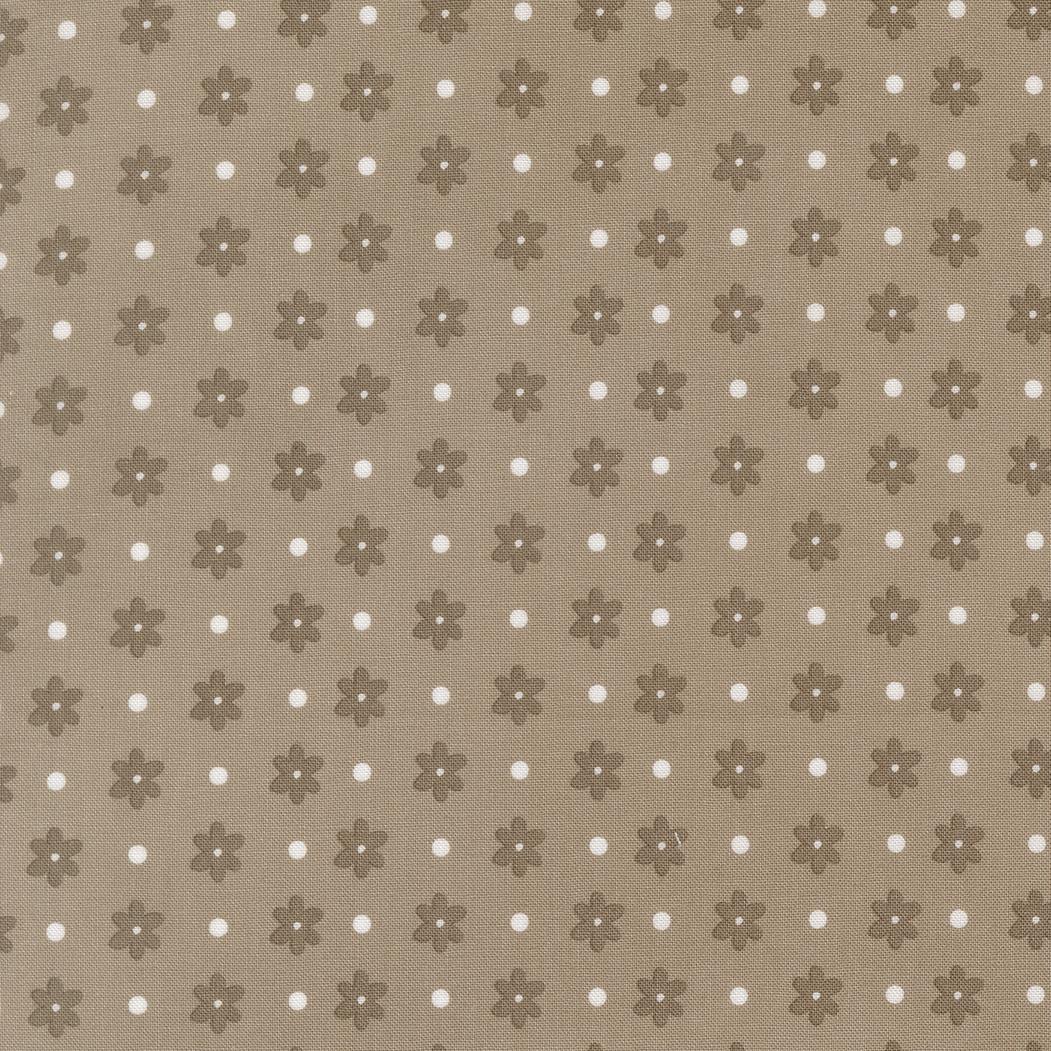 a repeating pattern of brown flowers with white polka dots on a beige background.