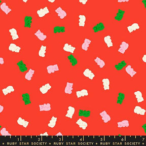 a vibrant red background with a playful pattern of pink and green gummy bears scattered across it.