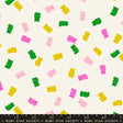 a pattern of colorful gummy bears scattered across a white background.