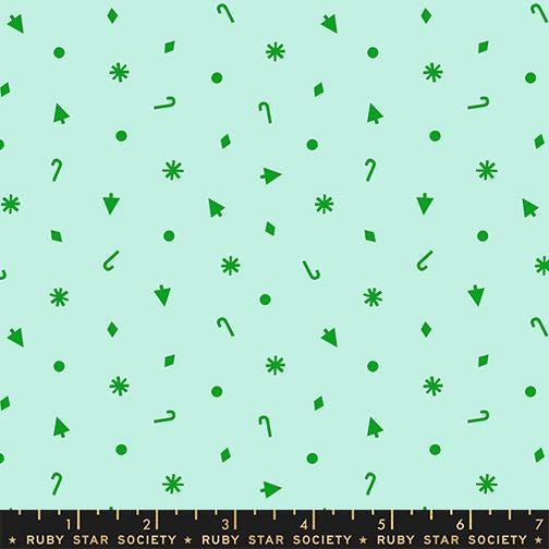 a pattern of green shapes and icons, including snowflakes, stars, and other decorative elements, scattered across a light blue background.