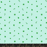 a pattern of green shapes and icons, including snowflakes, stars, and other decorative elements, scattered across a light blue background.
