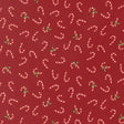 a pattern of red fabric with white and green candy canes scattered across it.