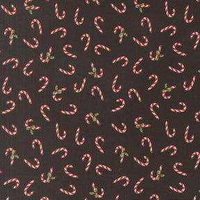 numerous red and white striped candy canes scattered across a dark background.