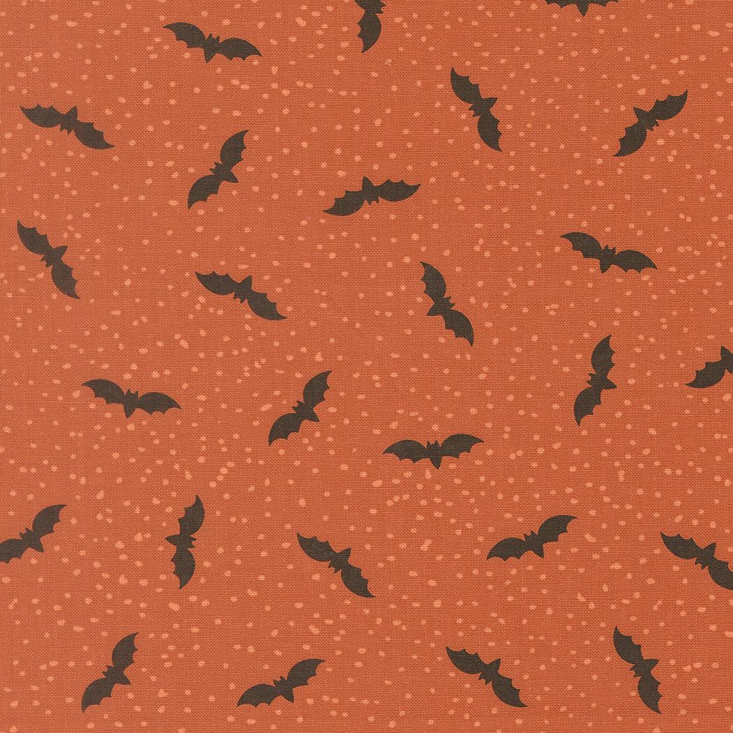 a repeating pattern of black bats against a textured orange background with small white dots, creating a visually striking and festive design.