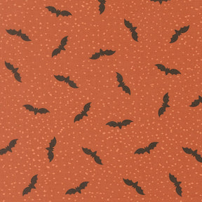 a repeating pattern of black bats against a textured orange background with small white dots, creating a visually striking and festive design.