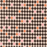 a repeating pattern of black and white diamonds with small pink and orange accents, creating a visually striking and geometric design.