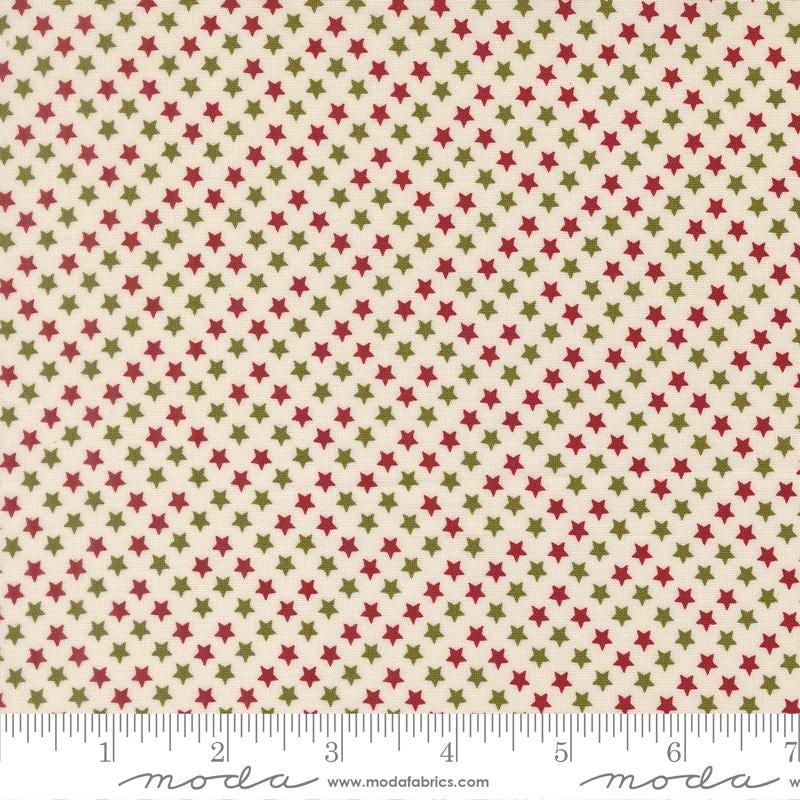 a fabric with a repeating pattern of red and green stars on a beige background.