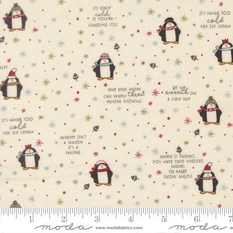 a white fabric with penguins and snowflakes