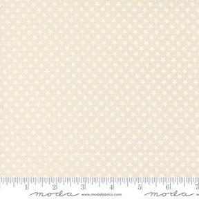 a fabric with a repeating pattern of white stars on a beige background.