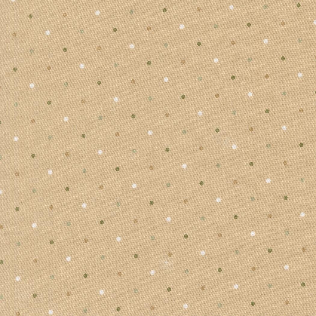 a repeating pattern of small white and tan dots on a beige background.