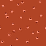 a repeating pattern of small, circular shapes in shades of orange and pink against a dark orange background.