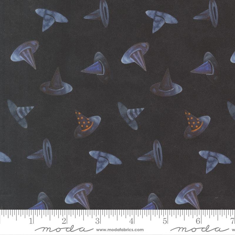 a pattern of witch hats on a dark background.
