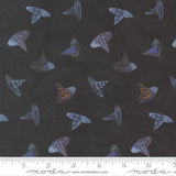 a pattern of witch hats on a dark background.